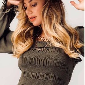 Smocked, puffed sleeve peplum top